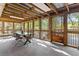Enclosed patio with seating area and nature views at 2371 Leguin Mill Rd, Locust Grove, GA 30248