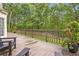 Spacious back deck with seating and a view of the lush green backyard at 4865 Chesterfield Ct, Suwanee, GA 30024