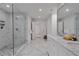 Bathroom with a glass-enclosed shower, marble floors, and dual vanity at 4865 Chesterfield Ct, Suwanee, GA 30024
