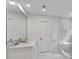 Bright bathroom with dual vanity, a large mirror, and a glass-enclosed shower with a bench at 4865 Chesterfield Ct, Suwanee, GA 30024