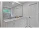 Bathroom with dual vanity, granite countertop, undermount sinks, and tiled shower at 4865 Chesterfield Ct, Suwanee, GA 30024