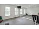 Spacious home gym featuring padded floors, mirrored wall, and a wall-mounted TV at 4865 Chesterfield Ct, Suwanee, GA 30024