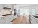Modern kitchen featuring stainless steel appliances and a cozy breakfast nook at 4865 Chesterfield Ct, Suwanee, GA 30024