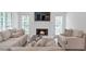 Cozy living room featuring a fireplace, neutral paint and ample seating at 4865 Chesterfield Ct, Suwanee, GA 30024