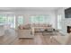 Bright and airy living room with a fireplace and large windows at 4865 Chesterfield Ct, Suwanee, GA 30024