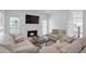 Inviting living room with fireplace, neutral paint, and access to the staircase at 4865 Chesterfield Ct, Suwanee, GA 30024