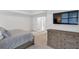 Main bedroom with a large bed, dresser, TV, and two doors leading to closet and bath at 4865 Chesterfield Ct, Suwanee, GA 30024