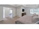 Main bedroom with tray ceiling, carpet, neutral walls, and access to walk-in closet and bath at 4865 Chesterfield Ct, Suwanee, GA 30024