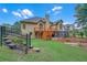 Backyard with a wooden deck and a well-manicured lawn, creating a perfect outdoor retreat at 8108 Greens Mill Way, Loganville, GA 30052