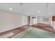 Finished basement with neutral walls, wood-look floors, and large carpet, providing a versatile living space at 8108 Greens Mill Way, Loganville, GA 30052
