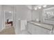 Well-lit bathroom with a doorway view into a bedroom and a large mirror at 8108 Greens Mill Way, Loganville, GA 30052