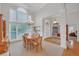 Dining room with hardwood floors, chair railing, and tall windows offering plenty of light at 8108 Greens Mill Way, Loganville, GA 30052