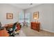 Comfortable home office with natural light and wood furnishings at 8108 Greens Mill Way, Loganville, GA 30052