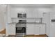 Beautiful kitchen featuring white cabinets, stainless steel appliances and granite countertops at 8108 Greens Mill Way, Loganville, GA 30052