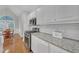 Modern kitchen featuring white cabinets, stainless steel appliances and granite counters at 8108 Greens Mill Way, Loganville, GA 30052