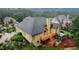Back of house with deck, screened-in room, with plenty of mature trees, grass, and privacy at 8108 Greens Mill Way, Loganville, GA 30052