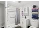 This bathroom features a sleek vanity with modern fixtures and a shower with a gray curtain for added style at 2860 Jefferson St, Austell, GA 30106