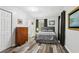 Serene bedroom with hardwood floors, closet, and a view of the adjacent bathroom at 2860 Jefferson St, Austell, GA 30106