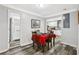 Cozy dining area with wood floors, seating for four, and a view into the kitchen at 2860 Jefferson St, Austell, GA 30106