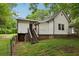 Charming house exterior with lawn, showcasing the home's architecture and landscaping at 2860 Jefferson St, Austell, GA 30106