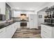 Contemporary kitchen with white cabinets, dark countertops, stainless steel appliances, and ample storage at 2860 Jefferson St, Austell, GA 30106