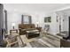 Bright living room with wood-look floors, comfortable seating, and neutral decor at 2860 Jefferson St, Austell, GA 30106