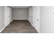 Finished basement with gray walls and wood-look floors, plus several storage closets at 4810 Habersham Se Way, Conyers, GA 30094