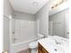 A full bathroom featuring a shower-tub combo, vanity with sink, toilet, and a large mirror at 4810 Habersham Se Way, Conyers, GA 30094
