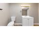 Bathroom featuring vanity with sink, toilet, mirror and modern vanity lighting at 4810 Habersham Se Way, Conyers, GA 30094