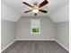 A bright bedroom featuring a ceiling fan, neutral paint, and a window that lets in natural light at 4810 Habersham Se Way, Conyers, GA 30094