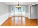 Bright dining room with beautiful hardwood floors and a bay window, perfect for Gathering gatherings and dinner parties at 4810 Habersham Se Way, Conyers, GA 30094