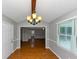 Charming dining area with rich hardwood floors and views into other rooms creating an inviting, spacious feel at 4810 Habersham Se Way, Conyers, GA 30094