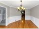 Inviting dining space featuring hardwood floors and chair rail molding for an elegant touch at 4810 Habersham Se Way, Conyers, GA 30094