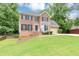 Charming two-story brick home with well-manicured lawn and attached two-car garage at 4810 Habersham Se Way, Conyers, GA 30094