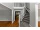 Spacious foyer with hardwood floors, staircase, and views of adjoining rooms at 4810 Habersham Se Way, Conyers, GA 30094
