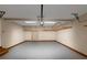 Spacious garage featuring overhead storage racks, storage and a coated floor at 4810 Habersham Se Way, Conyers, GA 30094