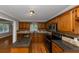 Stylish kitchen with wood cabinets, granite counters, stainless appliances and a breakfast bar for casual dining at 4810 Habersham Se Way, Conyers, GA 30094