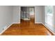 Bright living room with hardwood floors and a large window at 4810 Habersham Se Way, Conyers, GA 30094