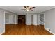 Open-concept living room with hardwood floors and views of other rooms at 4810 Habersham Se Way, Conyers, GA 30094