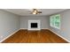 Inviting living room featuring hardwood floors, fireplace and natural lighting at 4810 Habersham Se Way, Conyers, GA 30094