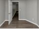 A room with hard flooring, neutral walls, and a white door at 4810 Habersham Se Way, Conyers, GA 30094