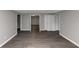 A room with hard flooring, neutral walls, and multiple doorways at 4810 Habersham Se Way, Conyers, GA 30094