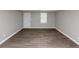 A room with hard flooring, neutral walls, and a window at 4810 Habersham Se Way, Conyers, GA 30094