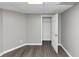 A room with hard flooring, neutral walls, and a white door at 4810 Habersham Se Way, Conyers, GA 30094