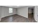 A room with hard flooring, neutral walls, and a window at 4810 Habersham Se Way, Conyers, GA 30094
