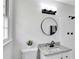 Updated bathroom with granite countertop, white subway tile shower, and modern black fixtures at 5774 Forest Dr, Acworth, GA 30102