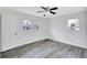 Bedroom features hardwood floors, natural light, and a ceiling fan at 5774 Forest Dr, Acworth, GA 30102