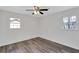 Bedroom featuring gray vinyl floors, white walls and ceilings, and natural light at 5774 Forest Dr, Acworth, GA 30102
