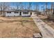 Charming white brick home with a welcoming entrance and long driveway at 5774 Forest Dr, Acworth, GA 30102