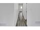 Long hallway featuring hardwood floors and white walls at 5774 Forest Dr, Acworth, GA 30102
